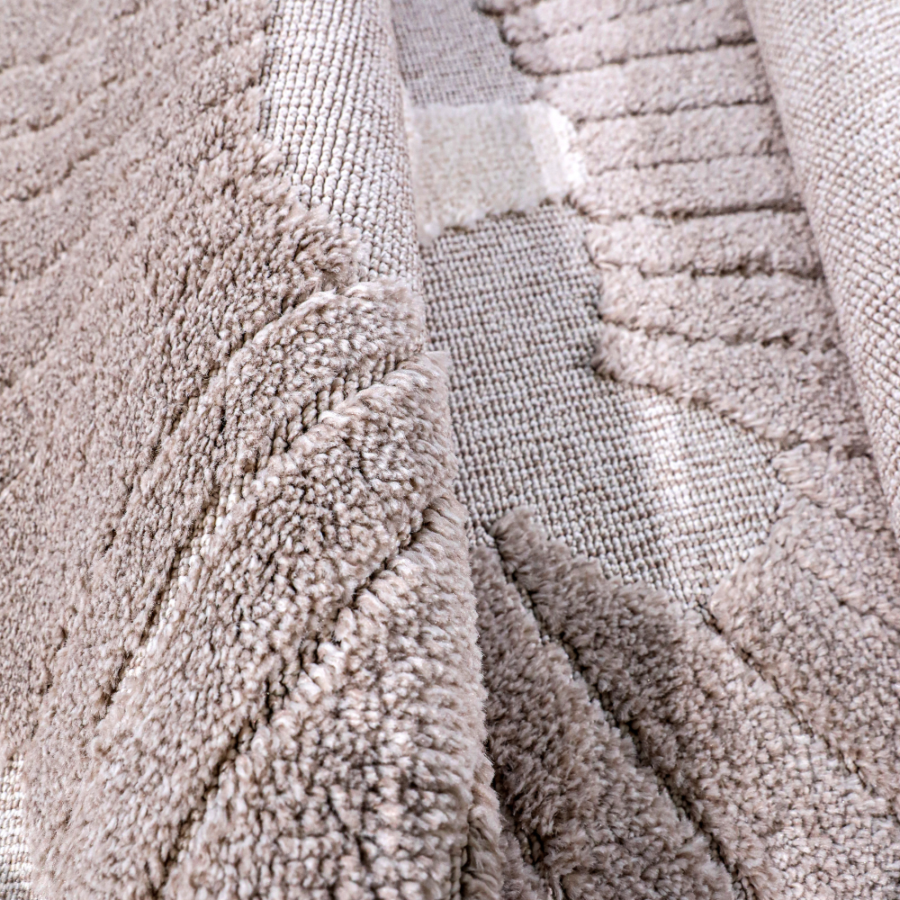 Soft textured detail of Distant Whispers Lion Woven Rug in neutral tones.