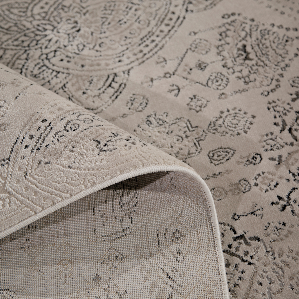 Finn Vintage Textured Rug in beige with intricate design, ideal for elegant home decor.